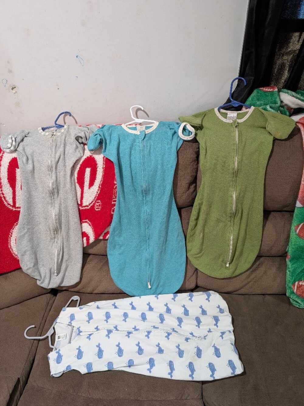 3 swaddle sacks , one sleeper sack